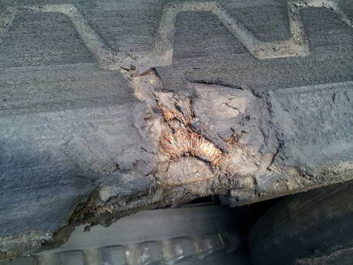 Damaged 14" asphalt paver tracks
